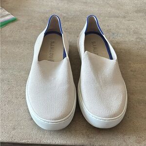 Rothy's Cream Slip-On Sneakers with Blue Trim